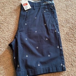 Navy blue flat front shorts with anchors by H&M